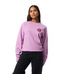The Rip Curl Womens Surf Puff Raglan Relaxed Sweatshirt in Bright Lilac