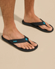 The Olukai Mens Ki‘i Flip Flops in Lava Rock & Bold Blue
