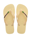 The Havaianas Mens Brazil Logo Flip Flops in Buttercream