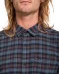 The Volcom Mens Caden Plaid Shirt in Raisin