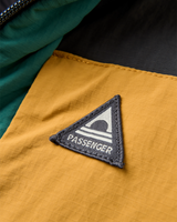 The Passenger Mens Oceanic Insulated Anorak in Faded Black & Deep Ocean