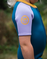 The C-Skins Girls NuWave C-Kid Baby Front Zip Shorty Wetsuit in Steel Blue & Lilac