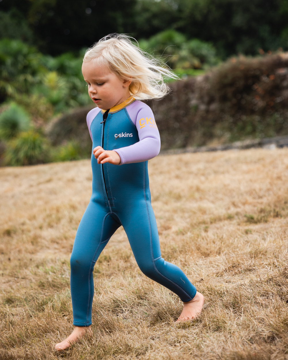 The C-Skins Girls NuWave C-Kid Baby Front Zip Wetsuit in Steel Blue & Lilac