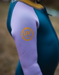 The C-Skins Girls NuWave C-Kid Baby Front Zip Wetsuit in Steel Blue & Lilac