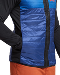 The Cotopaxi Mens Capa Hybrid Insulated Hooded Jacket in Black & Maritime
