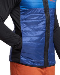 The Cotopaxi Mens Capa Hybrid Insulated Hooded Jacket in Black & Maritime
