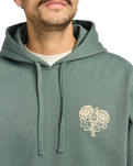 The RVCA Mens Flower Balance Hoodie in Balsam Green