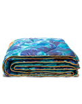 The Rumpl Nanoloft Puffy Blanket in Blazing Gaia