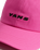 Check Side Curved Bill Jockey Cap in Pink Fizz