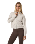 The Vuori Womens Halo Modern Full Zip Hoodie in Ecru Heather